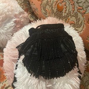 Going out for the evening? This ‘cache’ brand evening bag is the in thing.